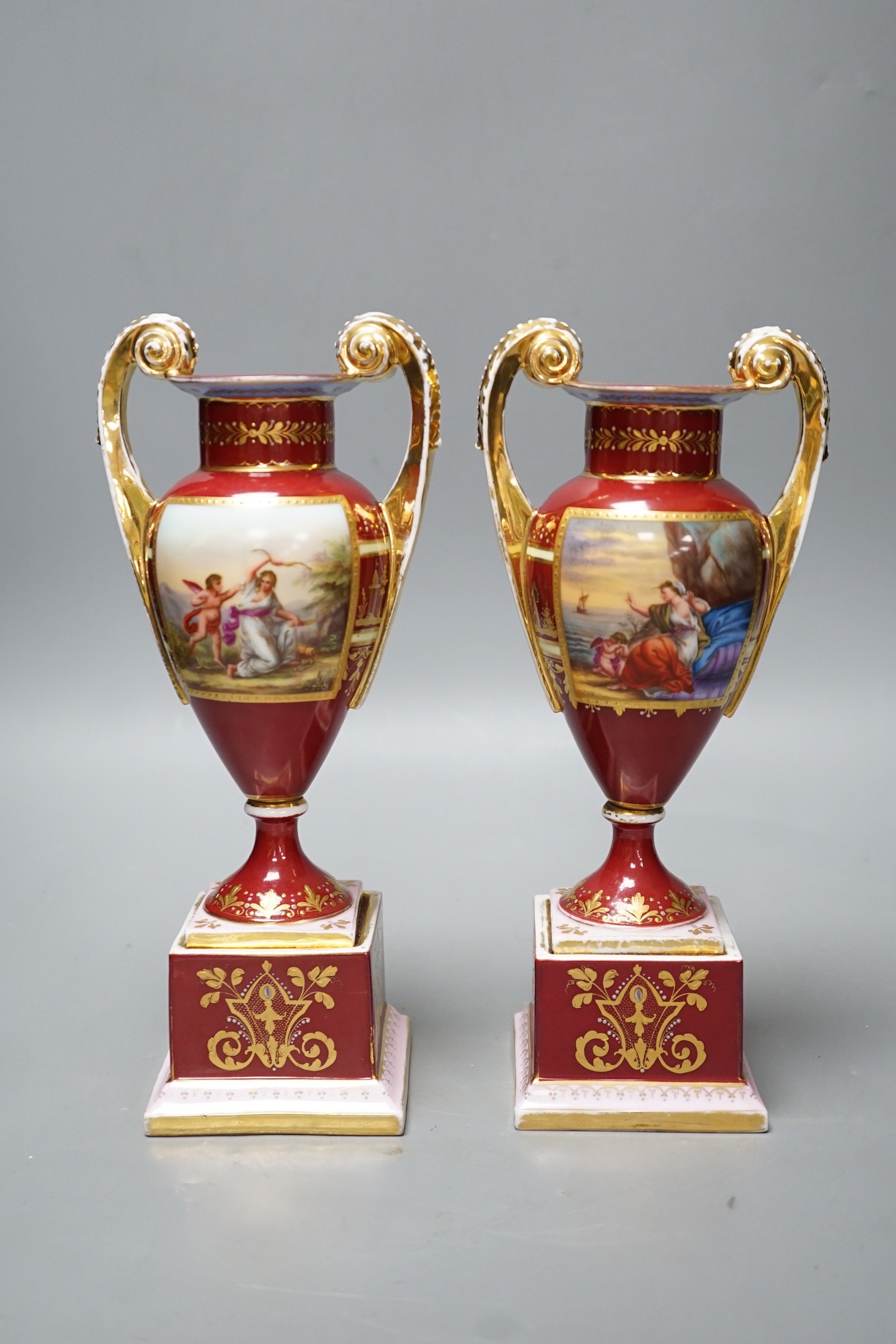 A pair of Vienna style painted porcelain vases, early 20th century 25cm